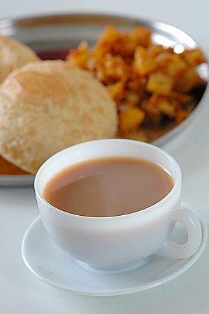 Sonti Tea with Puri and Potato Curry