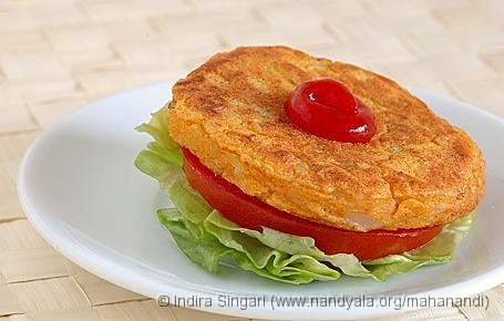 Alu Tikki with a slice of Tomato, Lettuce and Tomato Ketchup