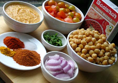 Cooked Chickpeas, tomatoes, pureed chickpea paste, cilantro, onion, red chilli powder, salt, chana masala powder(Badshah brand) and turmeric