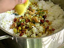 Mixing sautÃ¯Â¿Â½ed ingredients with rice along with lime juice