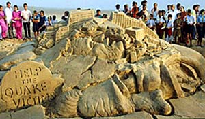 sand sculpture depicting trauma caused by the recent South Asian earthquake