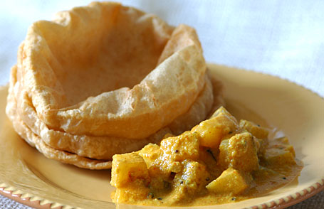 Mango sesame curry with puris
